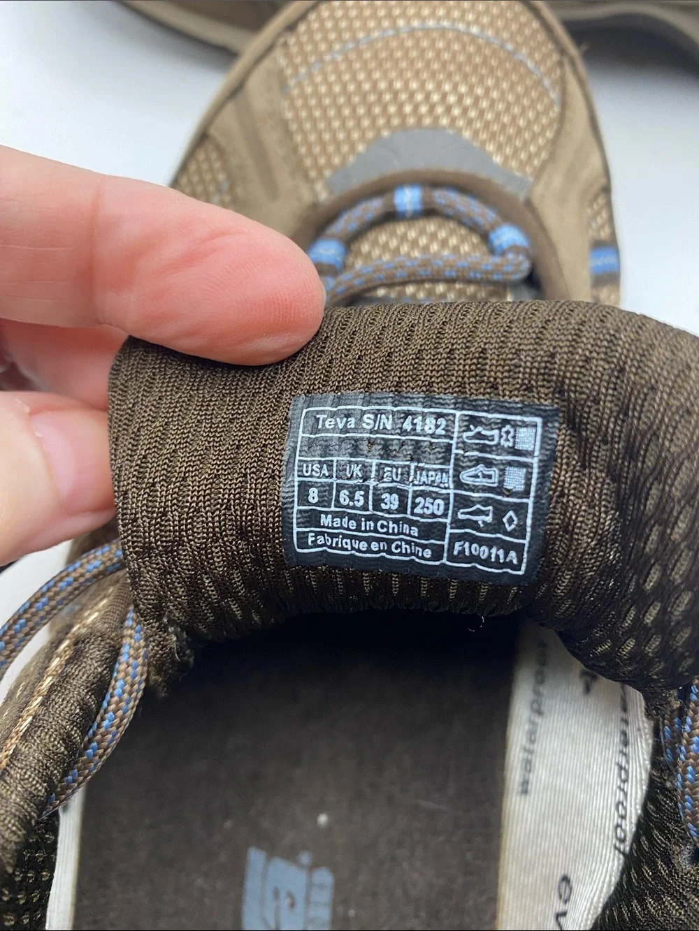 Teva Men's Brown Athletic Shoes with Blue Accents